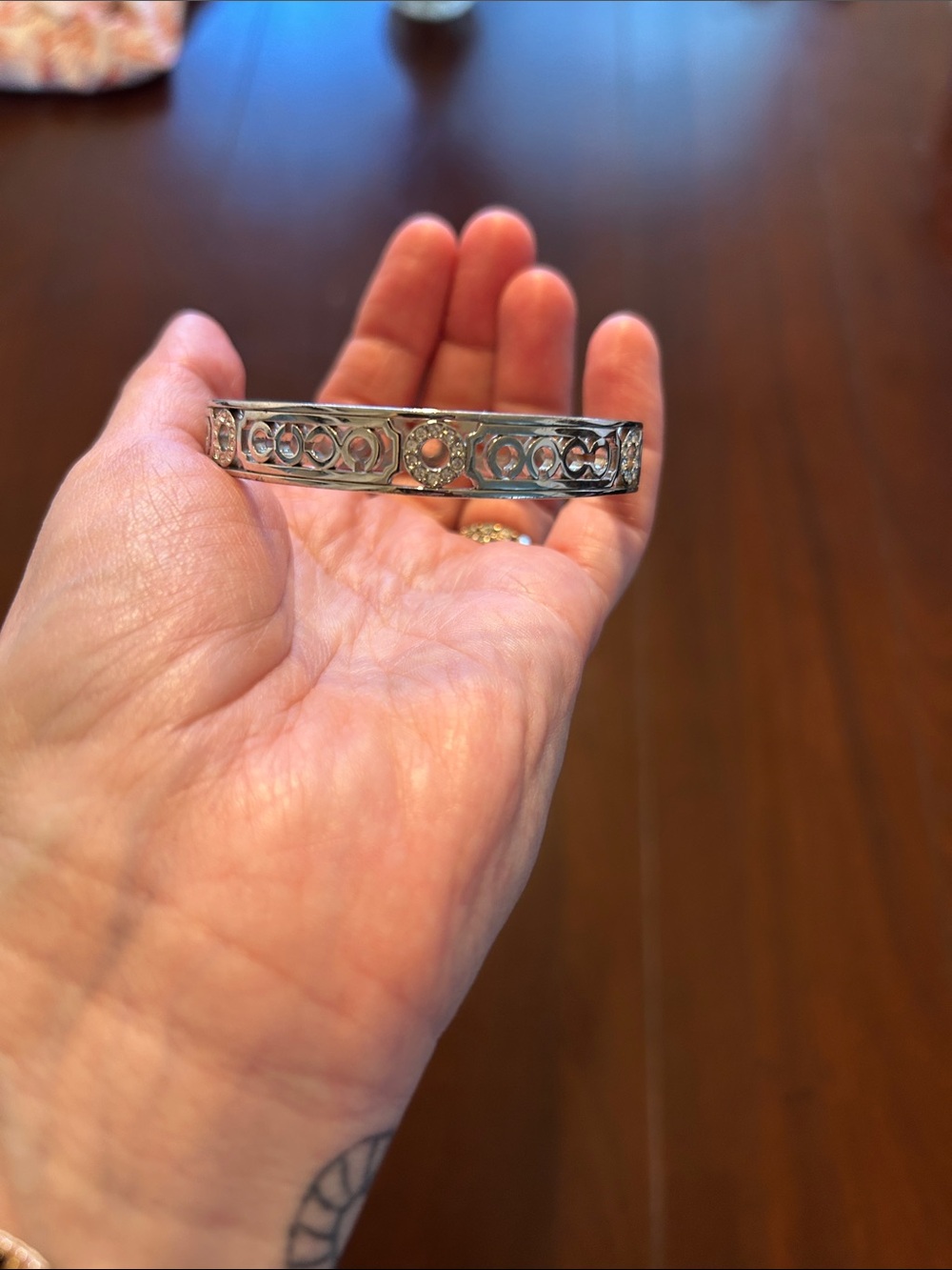 Coach Silver Tone Filigree Bangle Bracelet